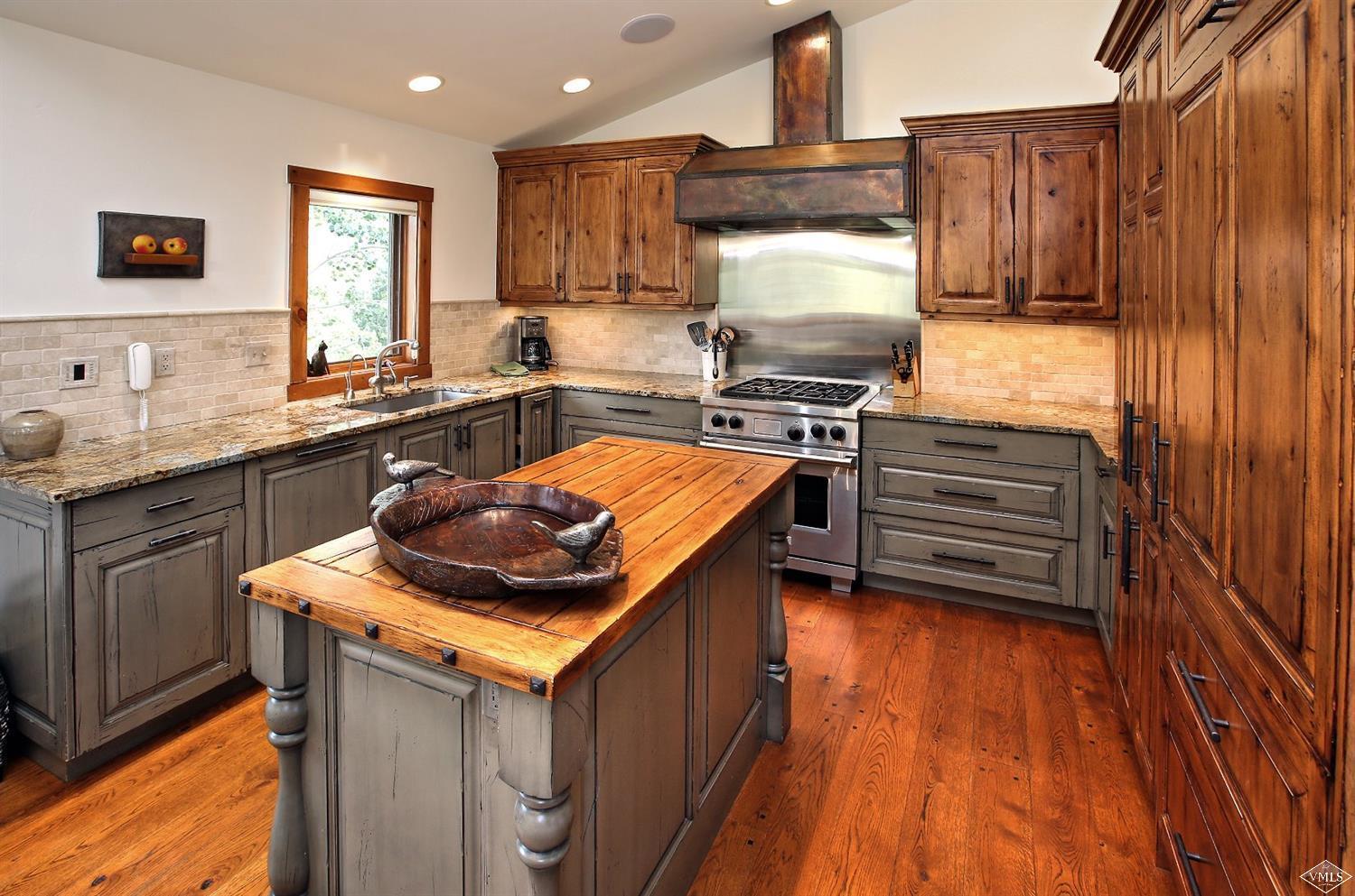 179 Knudson Ranch Road Edwards, CO 81632 - Photo 2 of 21 a kitchen with stainless steel appliances granite countertop a stove a sink and a microwave