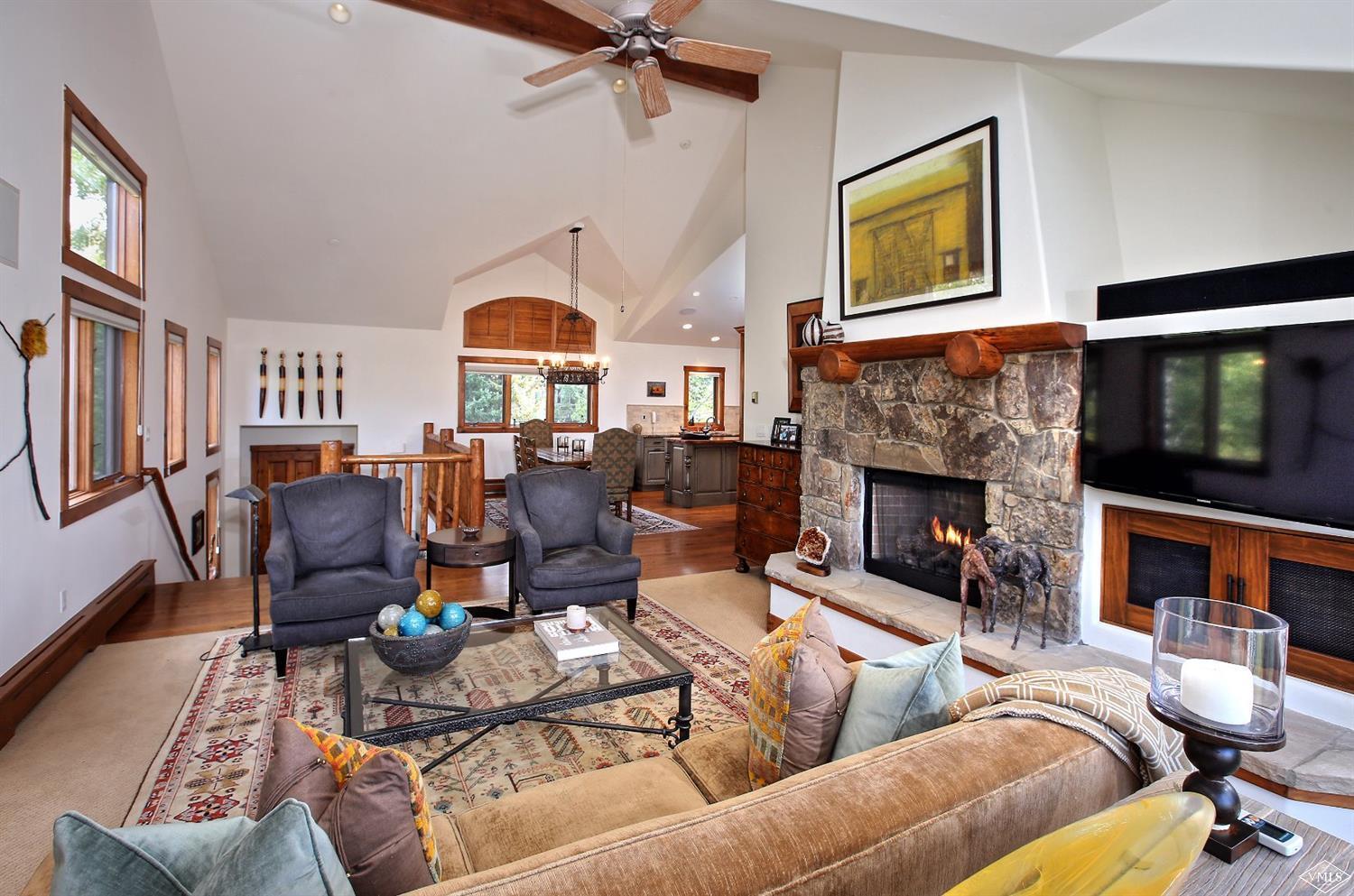 179 Knudson Ranch Road Edwards, CO 81632 - Photo 6 of 21 a living room with furniture fireplace and a fireplace