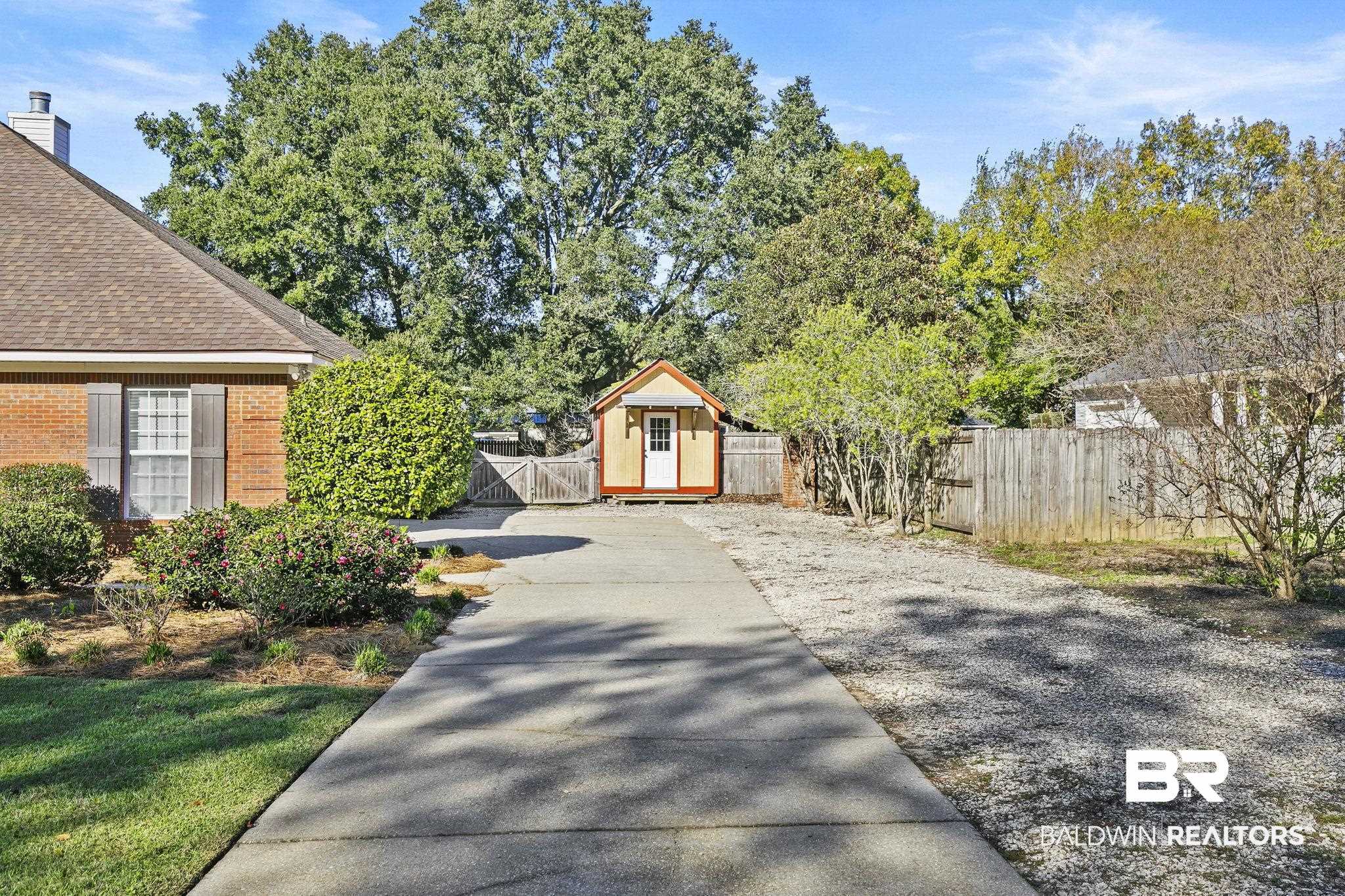 9631 Bay Meadows Avenue Fairhope, AL 36532 - Photo 2 of 49 View of yard featuring a storage unit