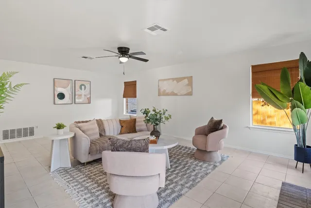 a living room with furniture and a window