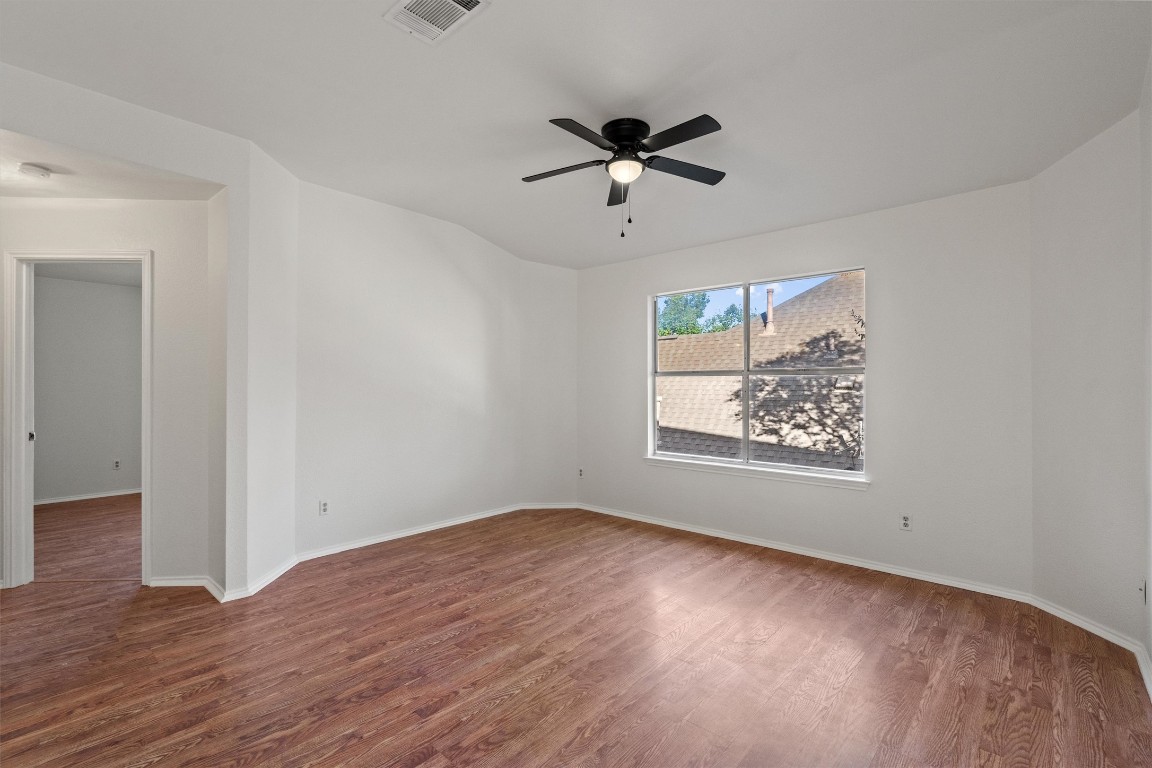 2602 Rainfall Trail Cedar Park, TX 78613 - Photo 20 of 36 a view of a big room with wooden floor closet and windows