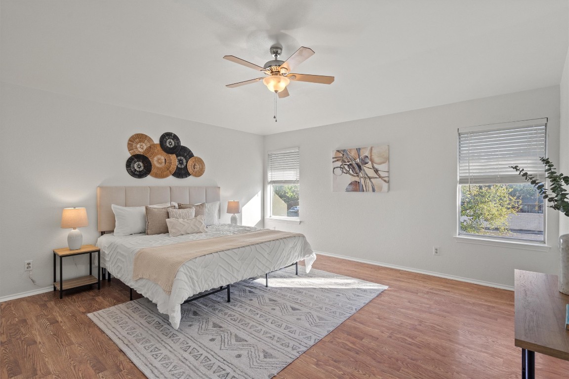 2602 Rainfall Trail Cedar Park, TX 78613 - Photo 23 of 36 a bedroom with a bed and a chandelier