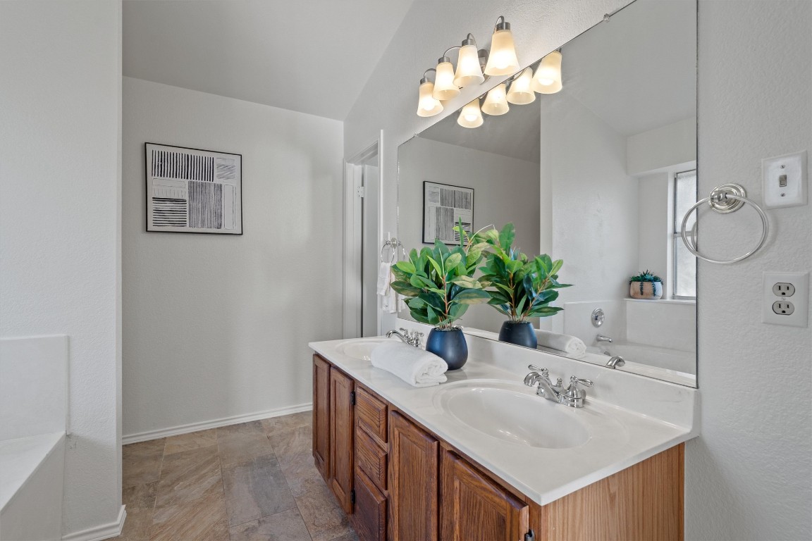 2602 Rainfall Trail Cedar Park, TX 78613 - Photo 25 of 36 a bathroom with a sink vanity and a mirror