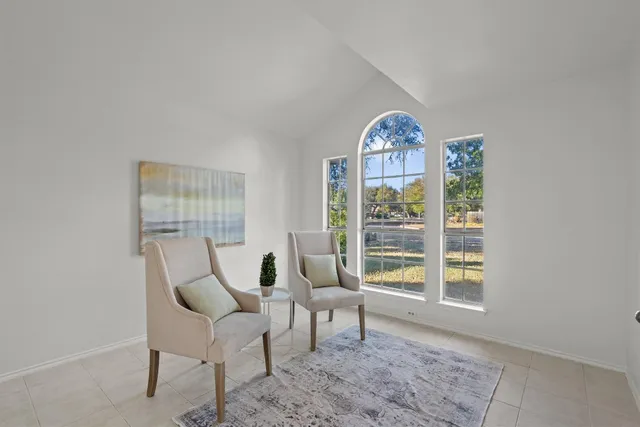 a view of a livingroom with furniture and window