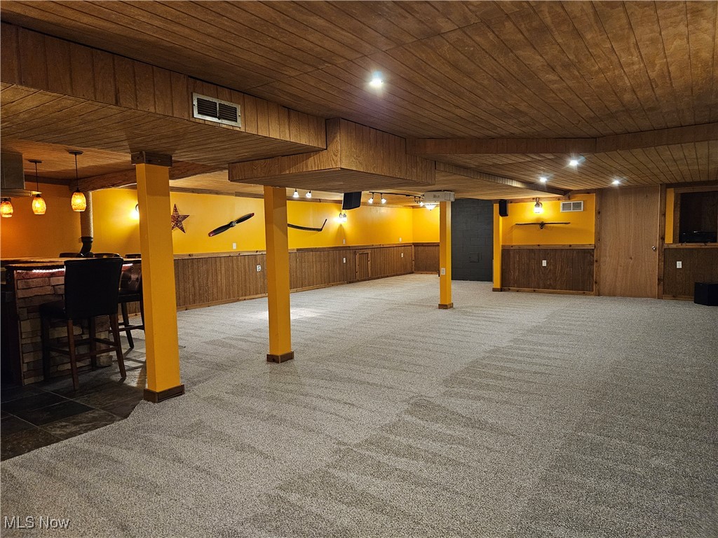 6155 Beach Road Wadsworth, OH 44281 - Photo 30 of 49 View of finished basement rec room and bar, with wood ceilings, adjustable lighting, carpet flooring