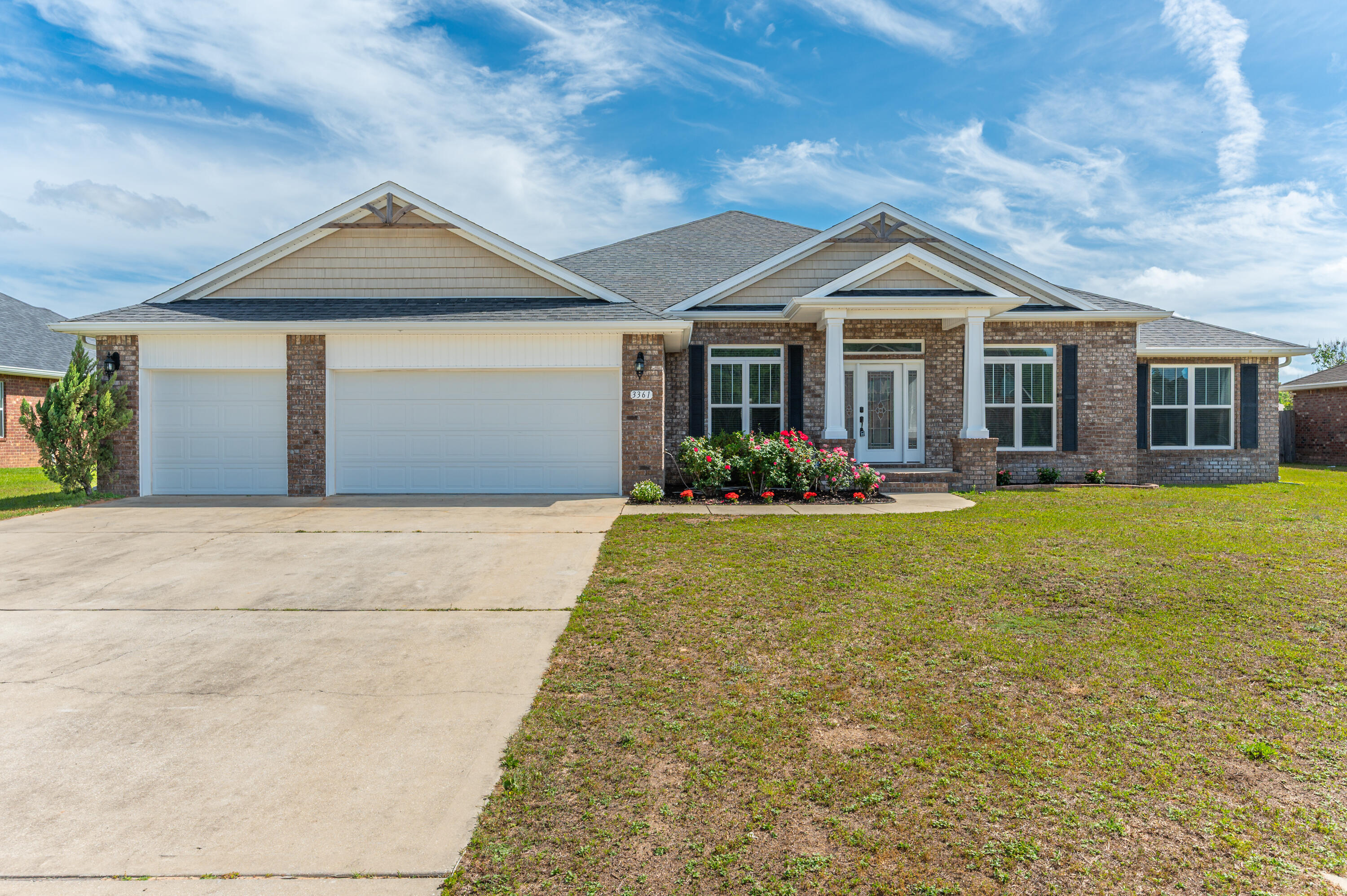3361 Citrine Circle Crestview, FL 32539 - Photo 1 of 34 a front view of a house with garden