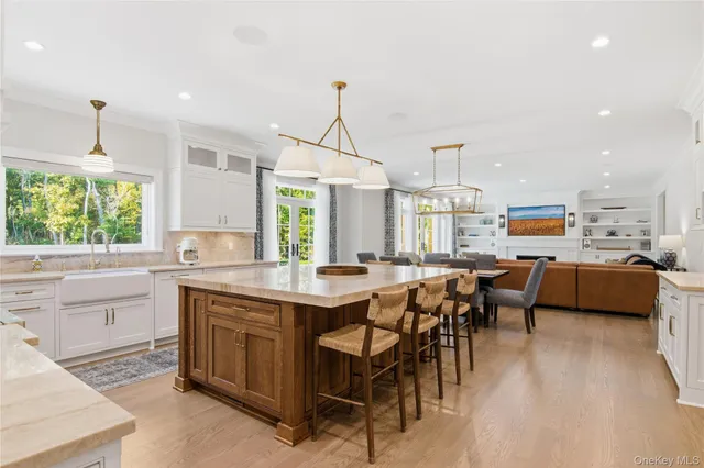 a kitchen with lots of counter top space and dining table