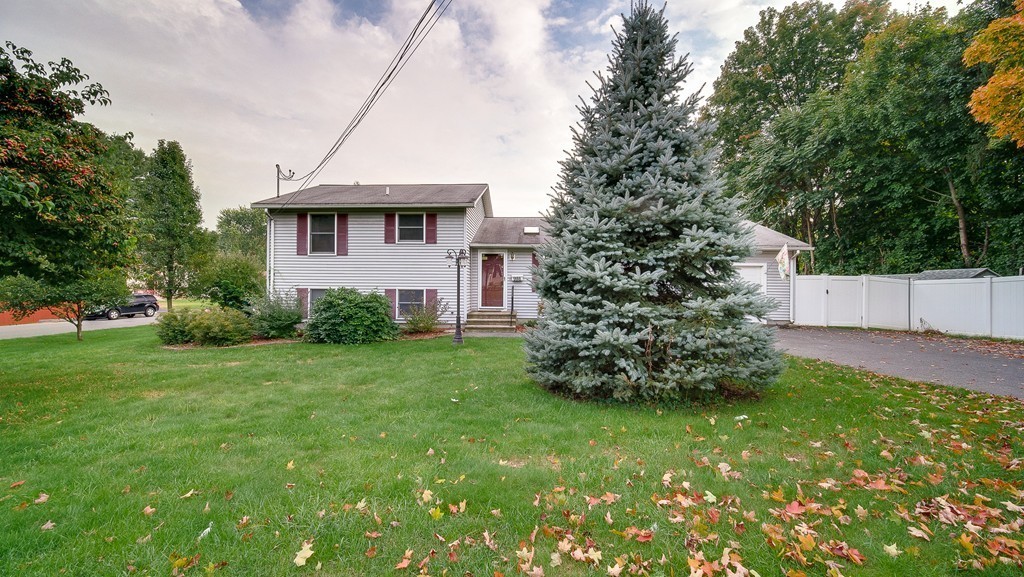 986 Allen Street Springfield, MA 01118 - Photo 1 of 30 a front view of a house with garden