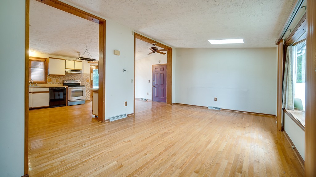 986 Allen Street Springfield, MA 01118 - Photo 11 of 30 a view of a big room with wooden floor and windows