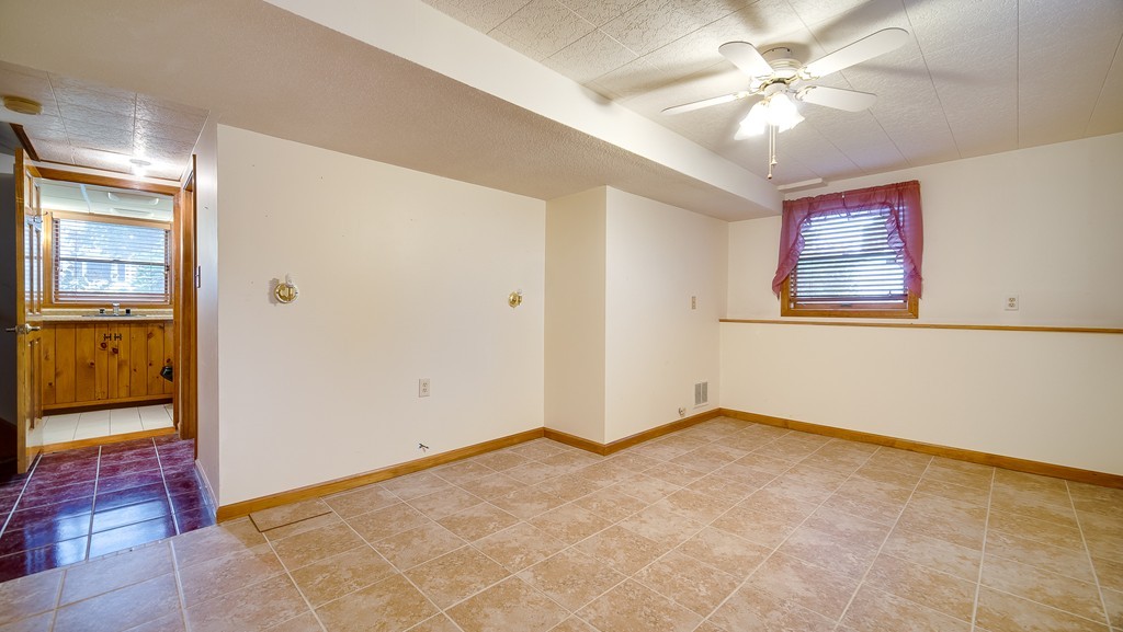 986 Allen Street Springfield, MA 01118 - Photo 13 of 30 an empty room with fan and windows
