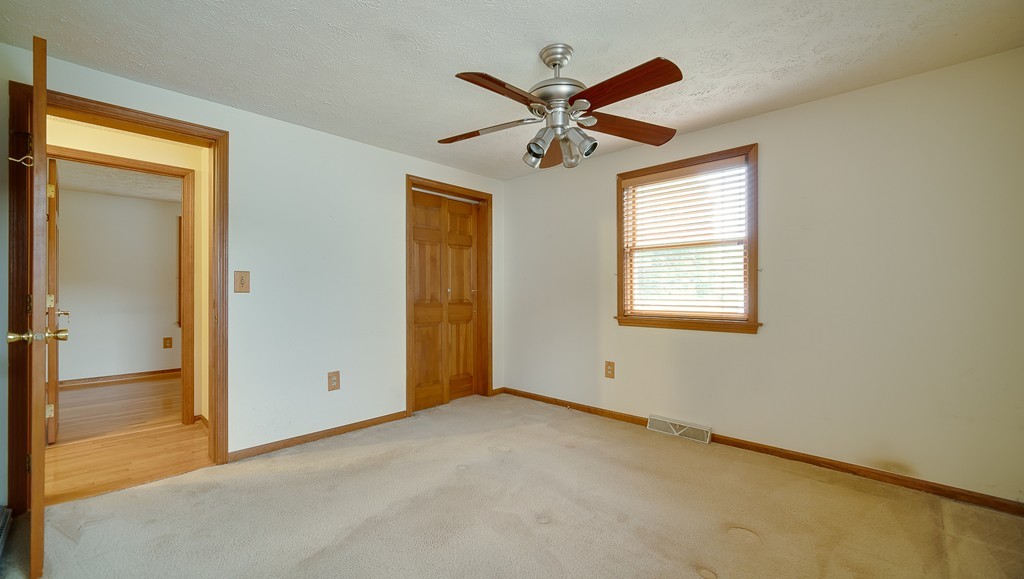 986 Allen Street Springfield, MA 01118 - Photo 20 of 30 a view of room with window and ceiling fan