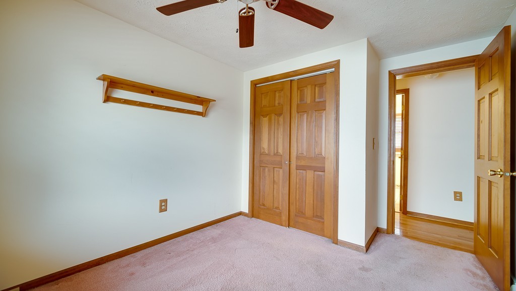 986 Allen Street Springfield, MA 01118 - Photo 22 of 30 an empty room with ceiling fan and window