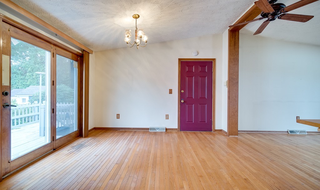 986 Allen Street Springfield, MA 01118 - Photo 7 of 30 a view of a room with wooden floor and a window
