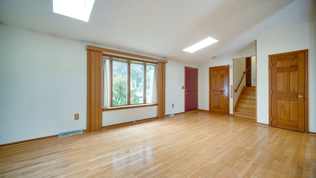 986 Allen Street Springfield, MA 01118 - Photo 8 of 30 a view of empty room with wooden floor and fan