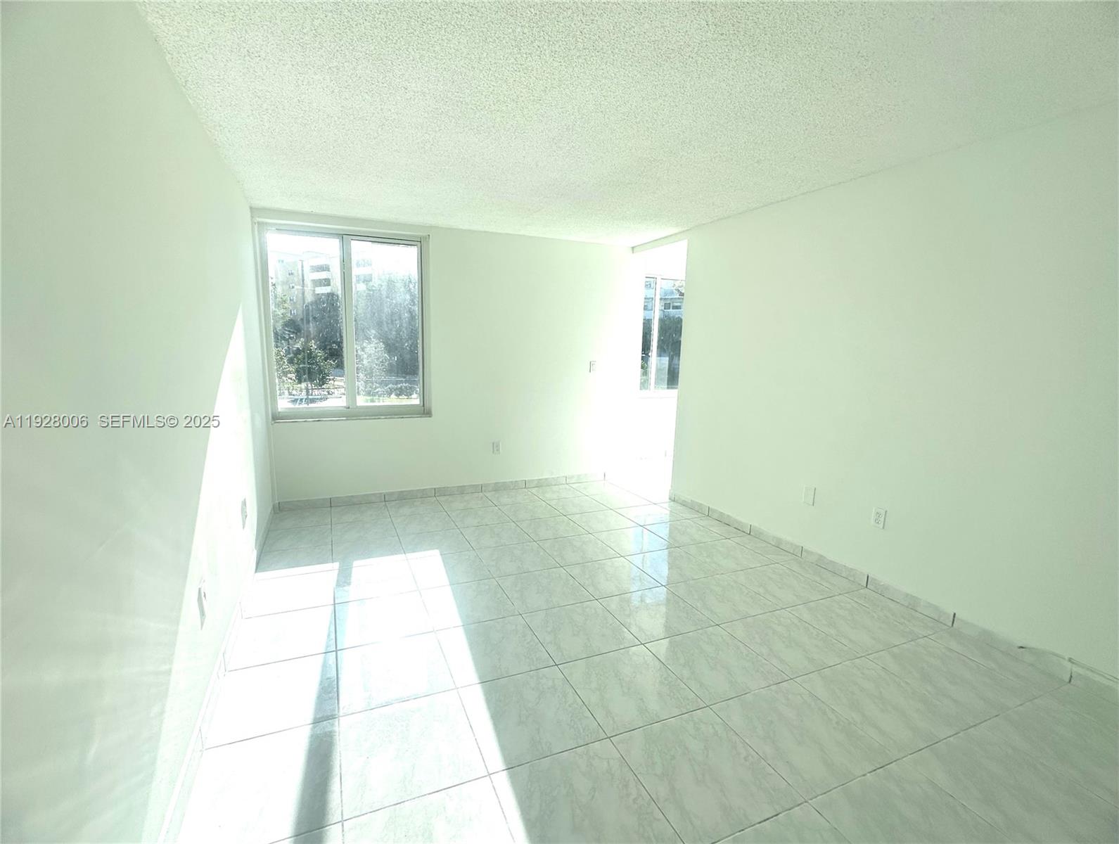 250 180th Drive, Unit 254 Sunny Isles Beach, FL 33160 - Photo 12 of 36 a view of an empty room and window