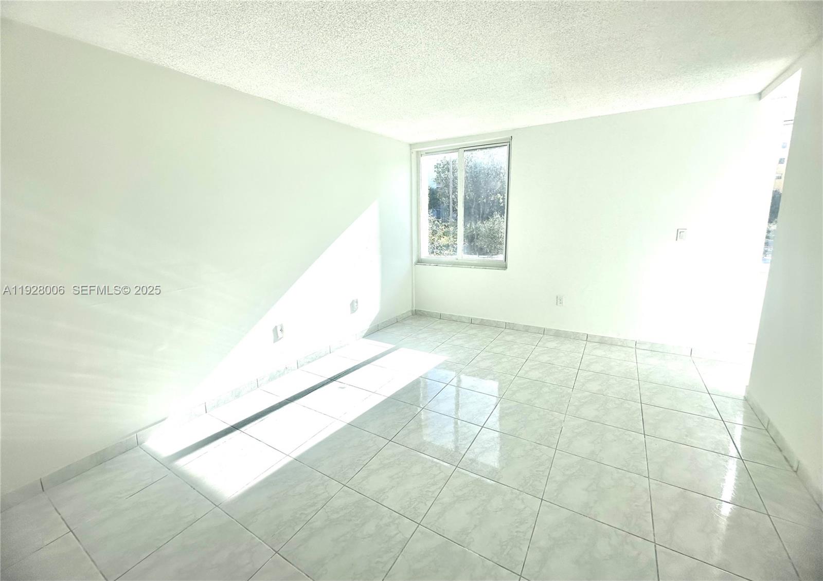 250 180th Drive, Unit 254 Sunny Isles Beach, FL 33160 - Photo 13 of 36 a view of an empty room and window