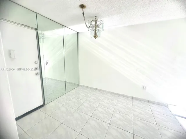 a bathroom with a toilet a sink a mirror and a shower