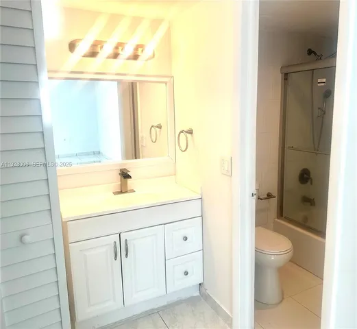 a bathroom with a shower and a toilet