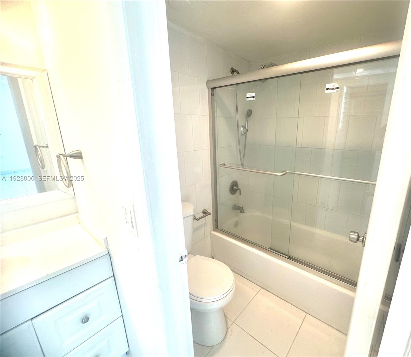 250 180th Drive, Unit 254 Sunny Isles Beach, FL 33160 - Photo 22 of 36 a bathroom with a shower and a toilet
