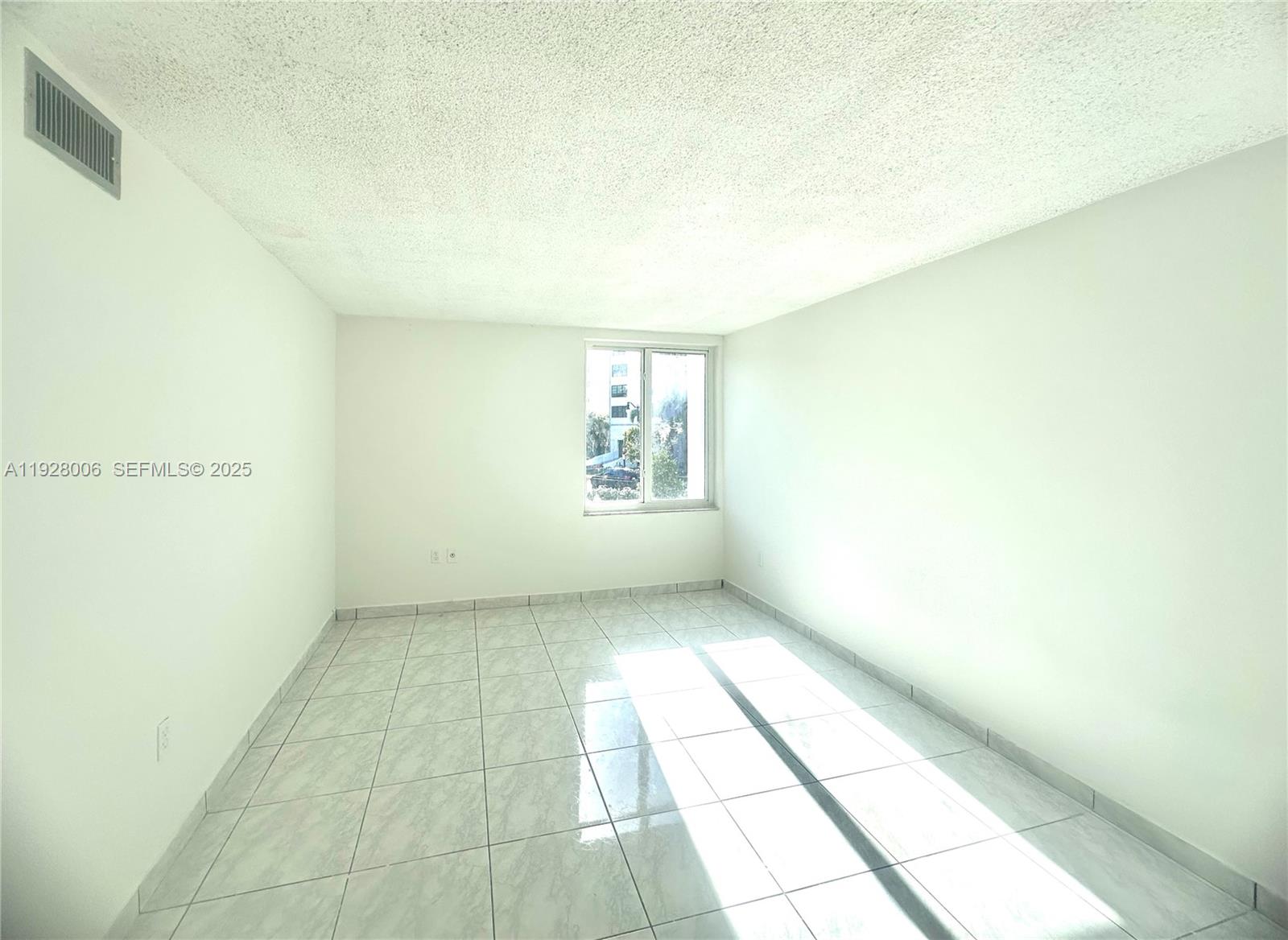 250 180th Drive, Unit 254 Sunny Isles Beach, FL 33160 - Photo 23 of 36 a view of an empty room and a window