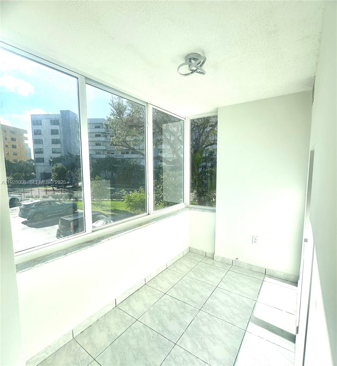 250 180th Drive, Unit 254 Sunny Isles Beach, FL 33160 - Photo 26 of 36 a view of a room with a large window