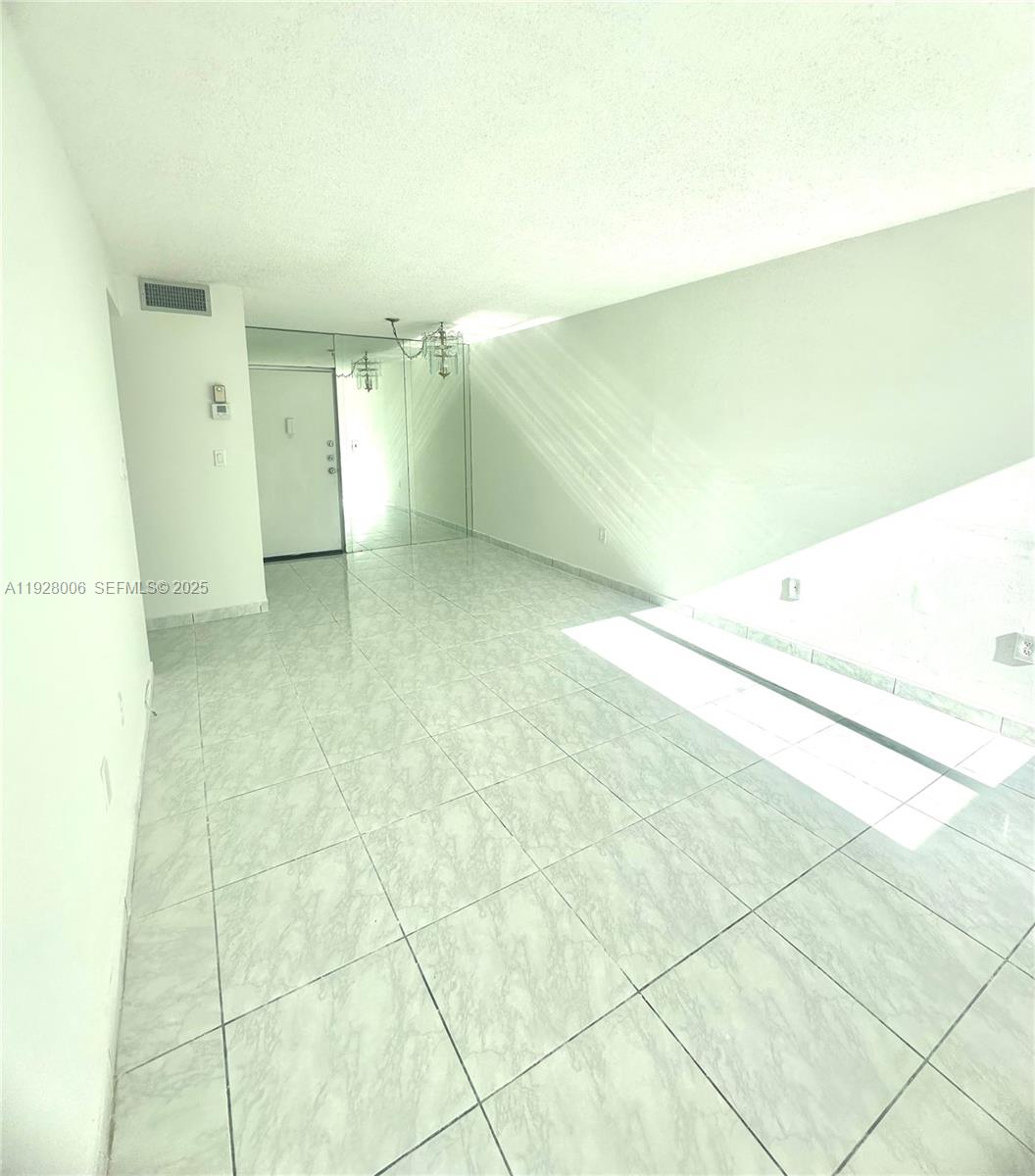 250 180th Drive, Unit 254 Sunny Isles Beach, FL 33160 - Photo 27 of 36 a view of an empty room