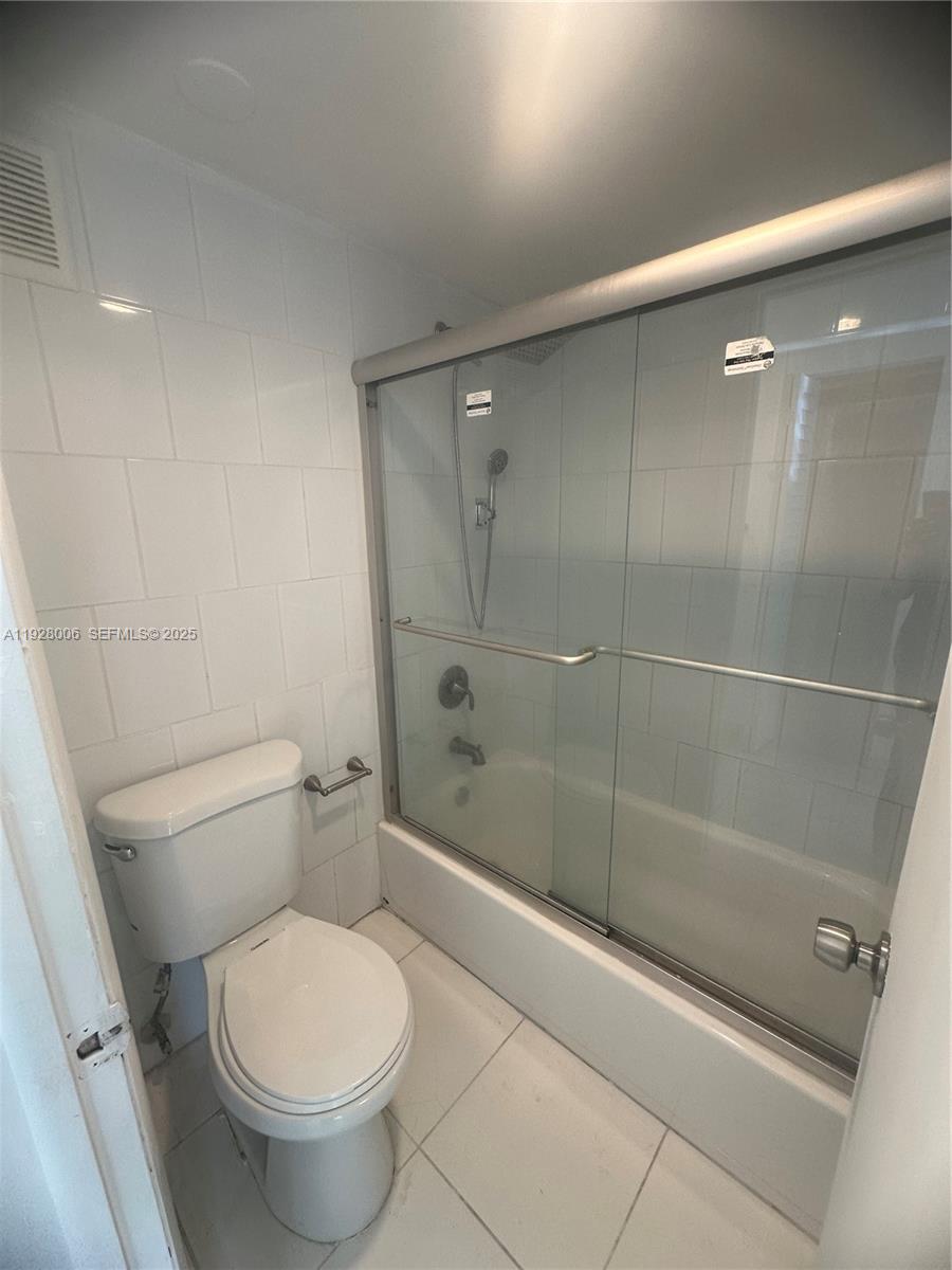 250 180th Drive, Unit 254 Sunny Isles Beach, FL 33160 - Photo 33 of 36 a bathroom with a toilet and a shower