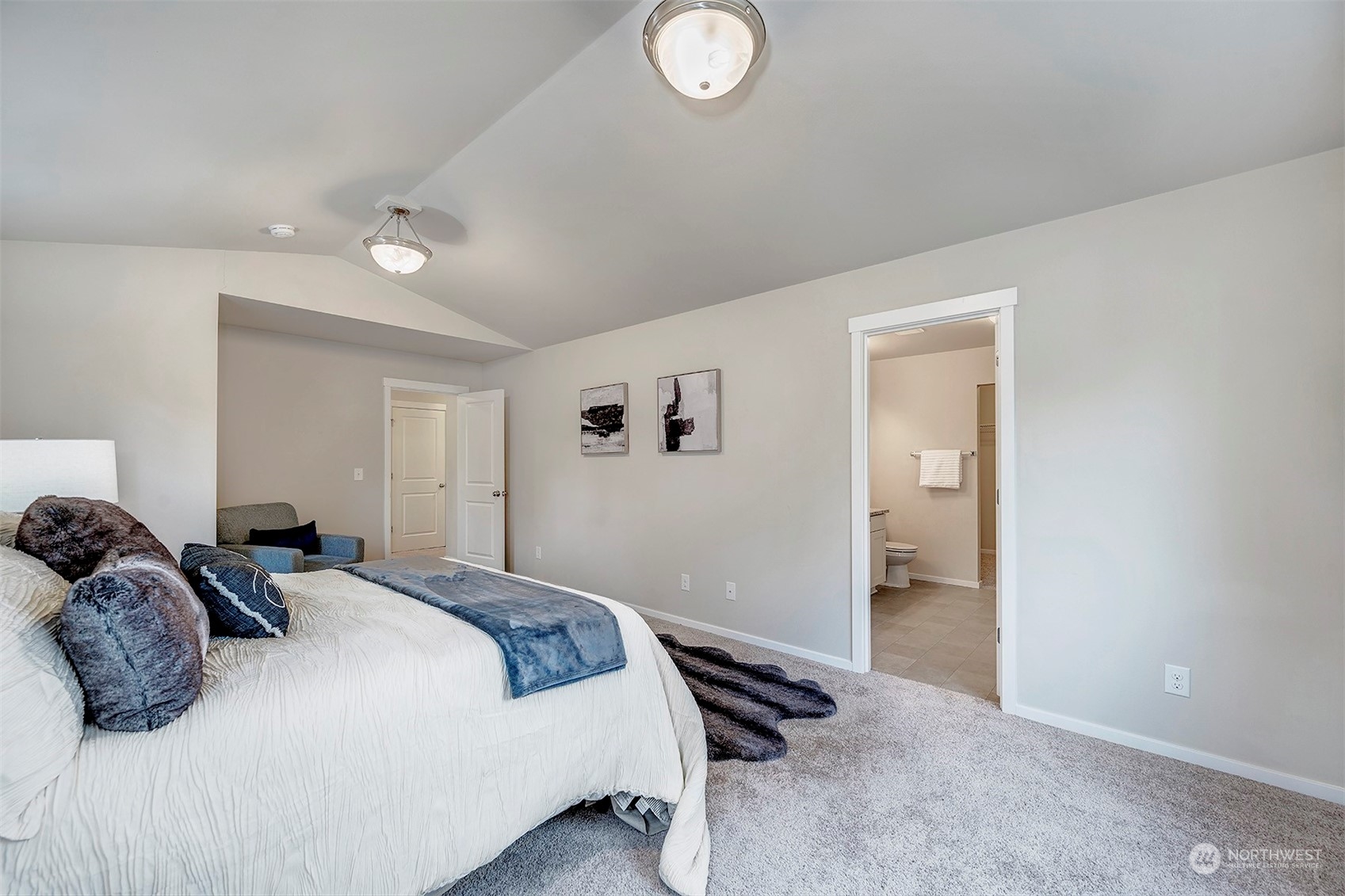 12329 23rd Drive Southeast, Unit 10 Everett, WA 98208 - Photo 13 of 24 a bedroom with a bed and a lamp