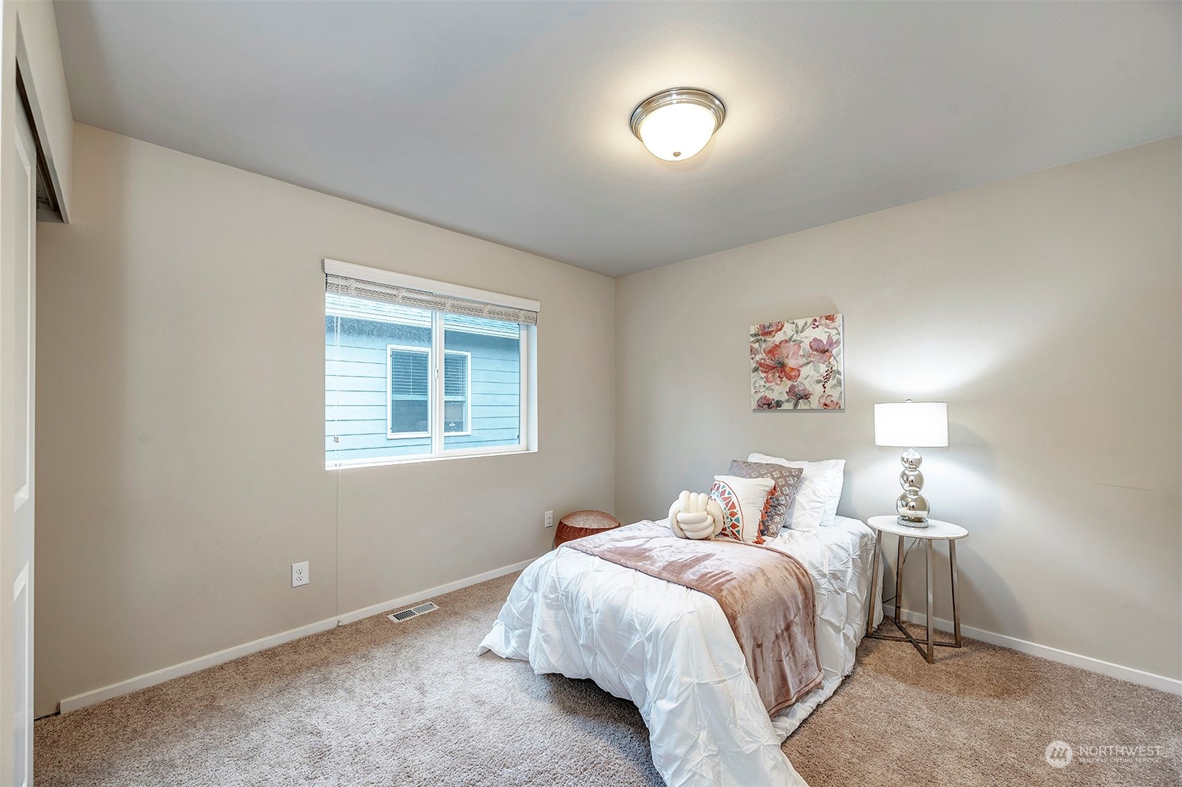 12329 23rd Drive Southeast, Unit 10 Everett, WA 98208 - Photo 18 of 24 a bedroom with a bed and a window