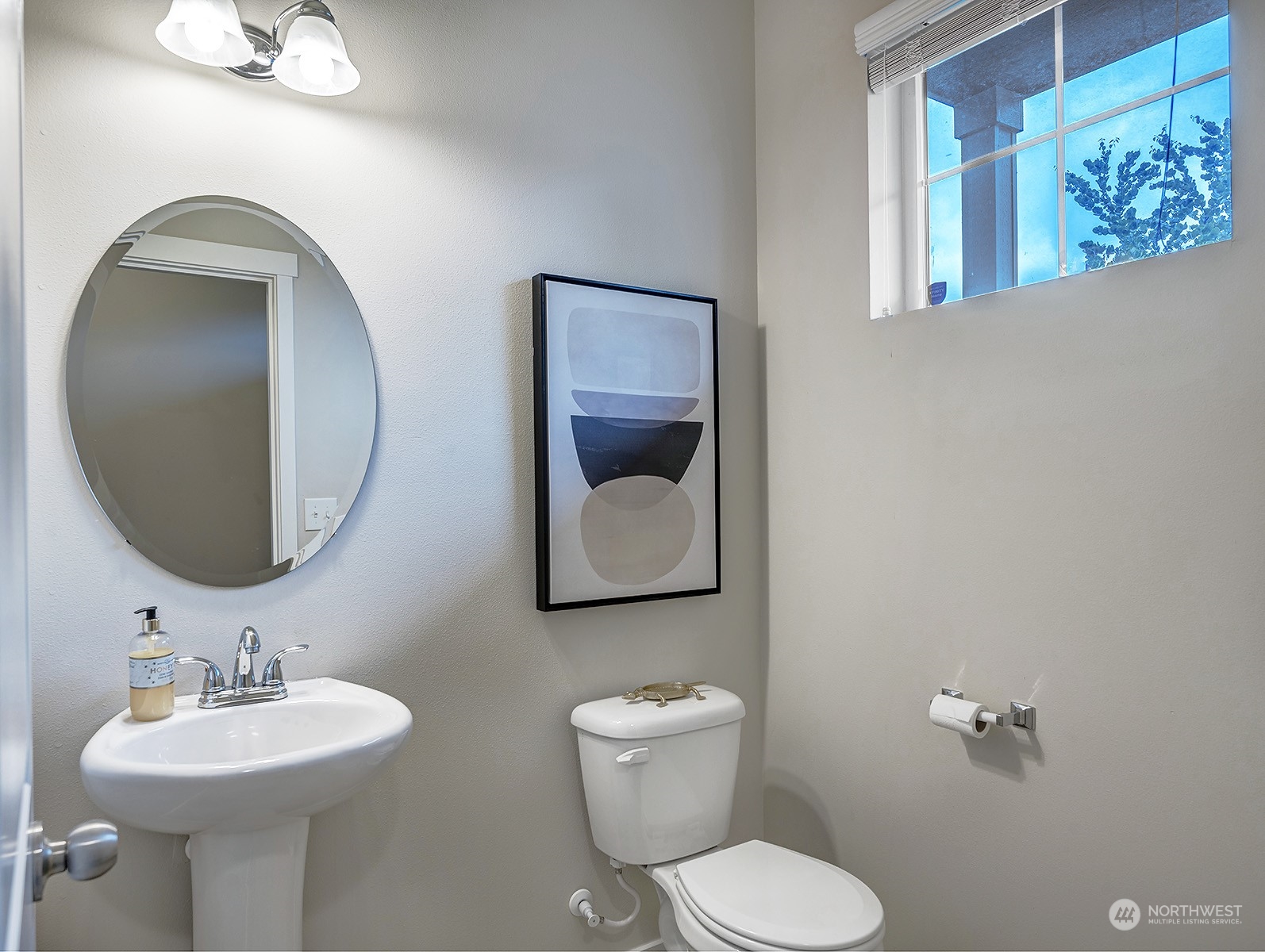 12329 23rd Drive Southeast, Unit 10 Everett, WA 98208 - Photo 22 of 24 a bathroom with a toilet sink and mirror