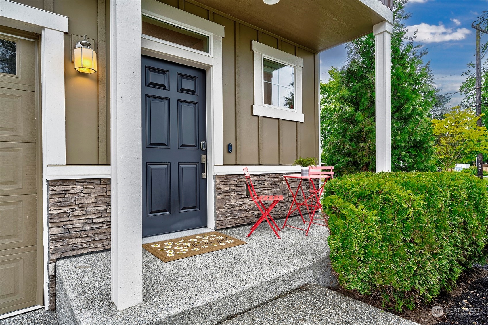 12329 23rd Drive Southeast, Unit 10 Everett, WA 98208 - Photo 3 of 24 a bench sitting in front of a house