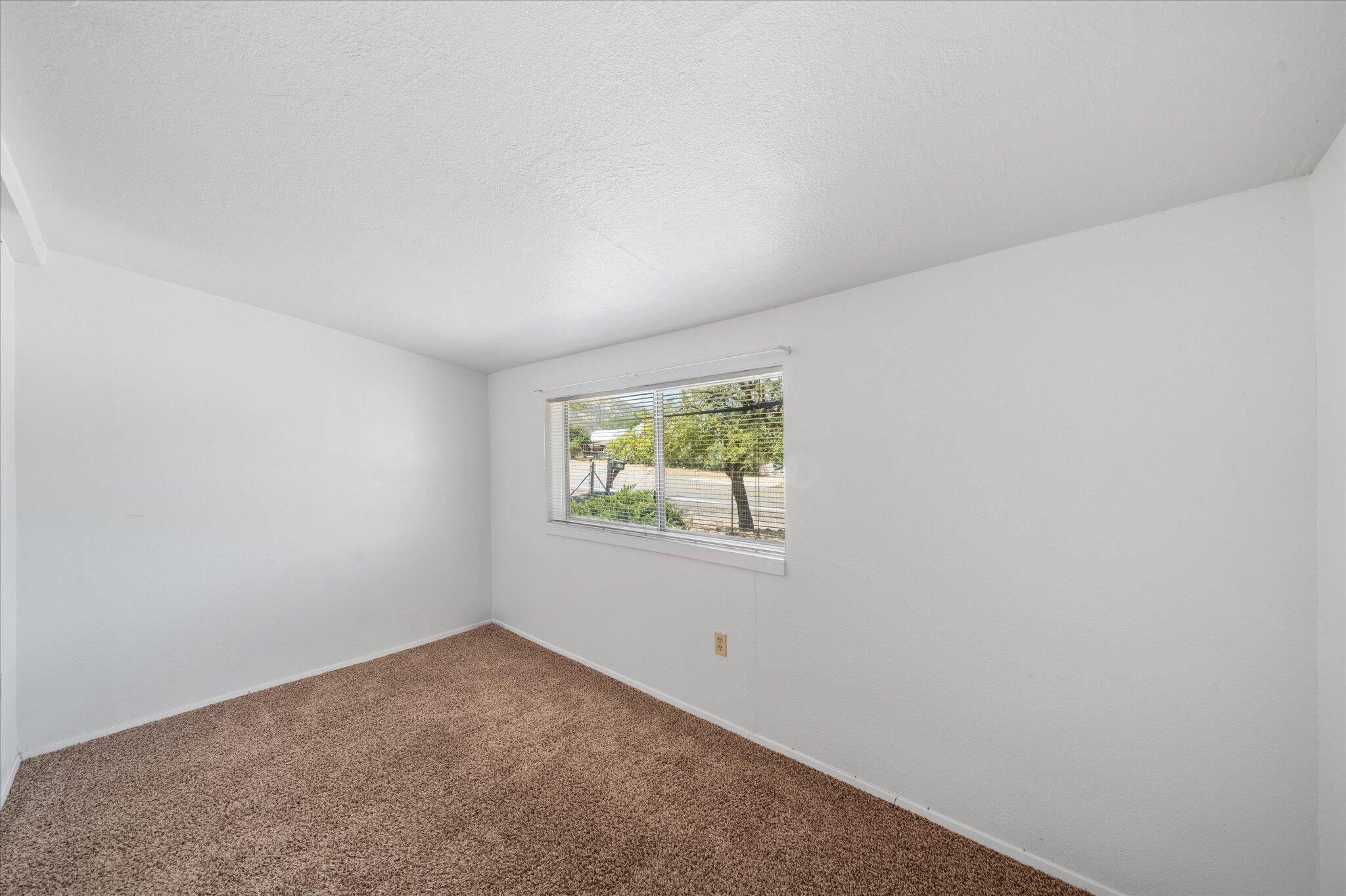 6535 Placer Road Igo, CA 96047 - Photo 12 of 39 an empty room with a window