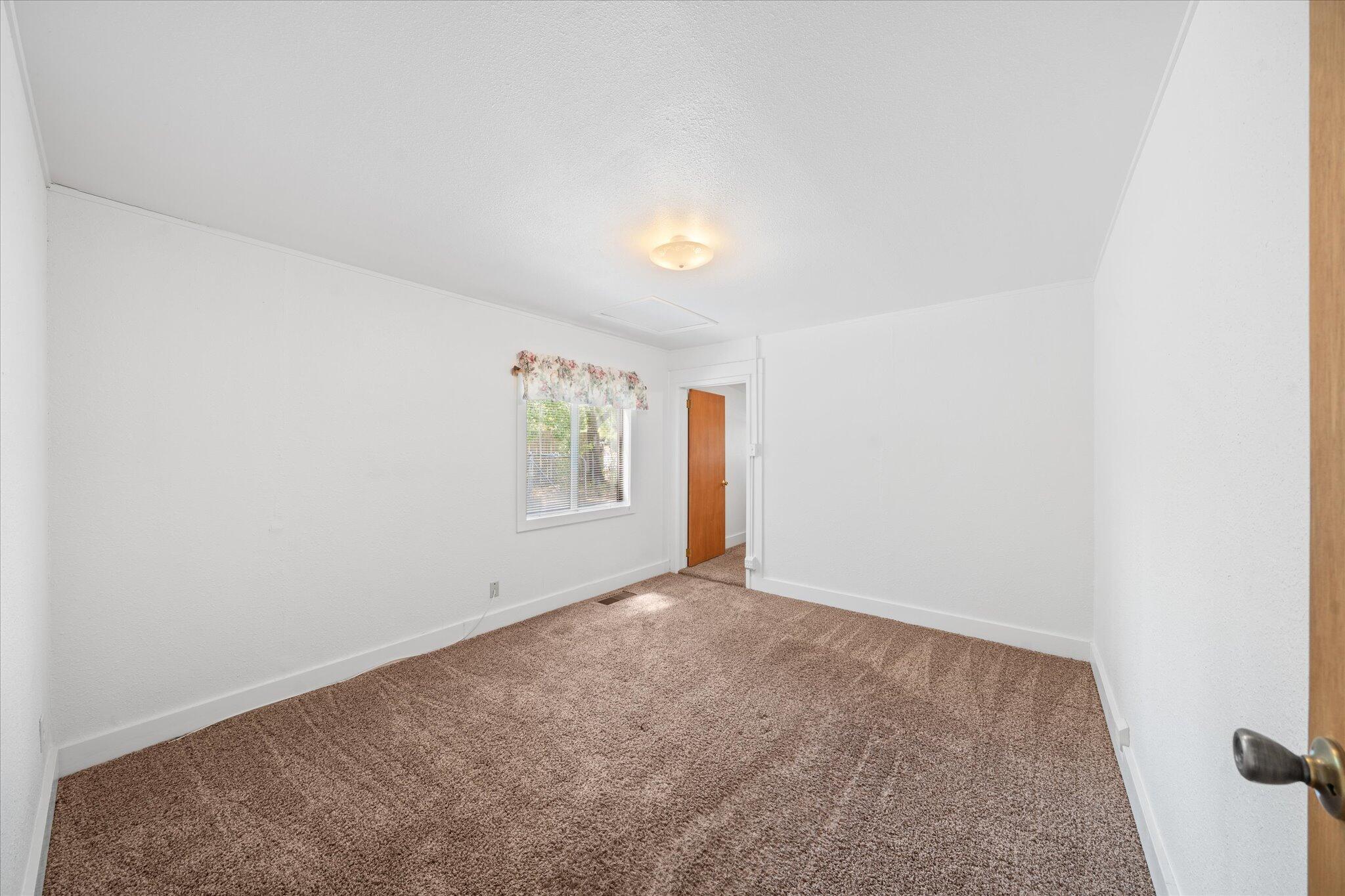 6535 Placer Road Igo, CA 96047 - Photo 17 of 39 a view of an empty room with a window