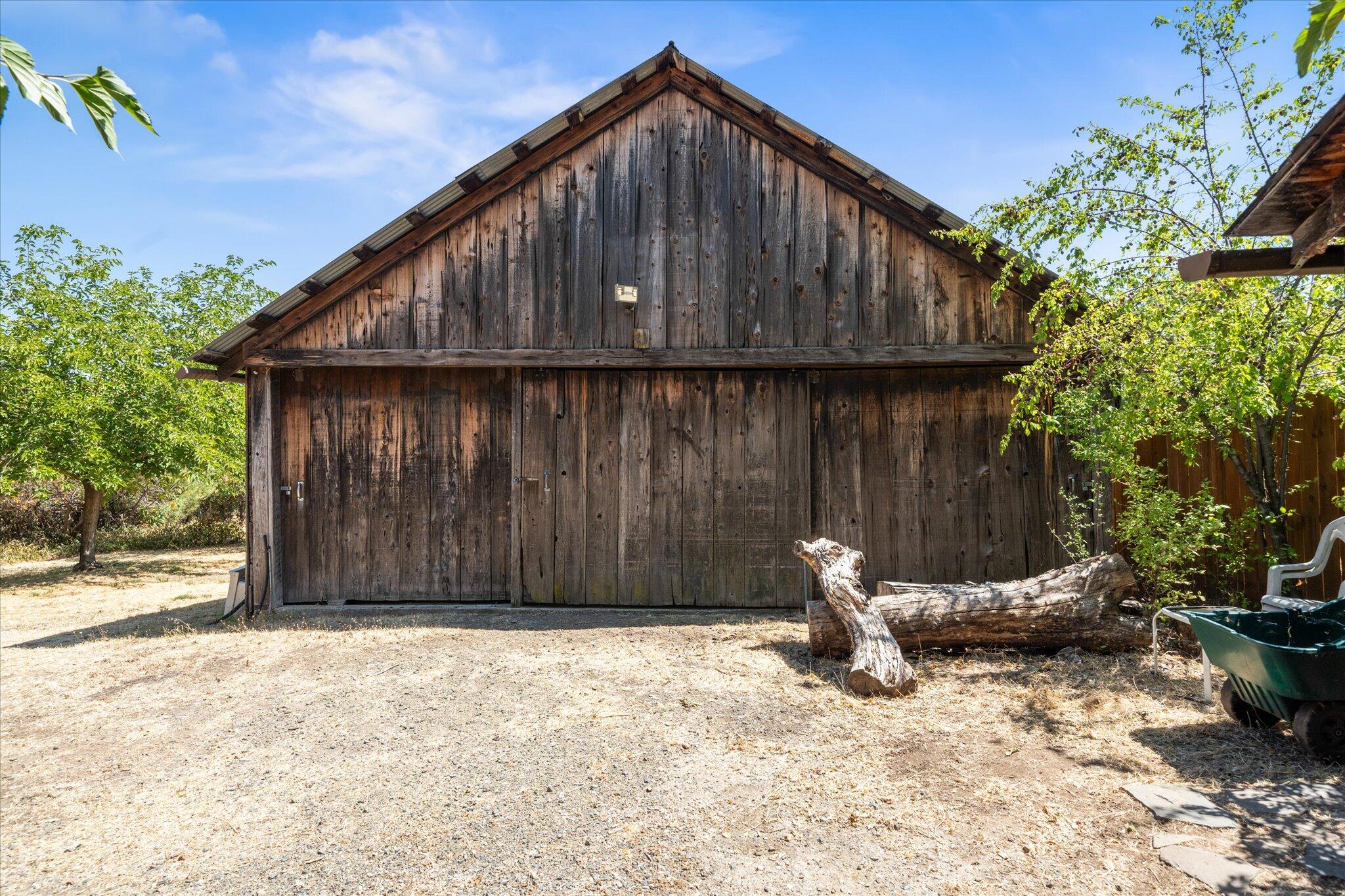 6535 Placer Road Igo, CA 96047 - Photo 24 of 39 a backyard of a house with barbeque oven and outdoor seating