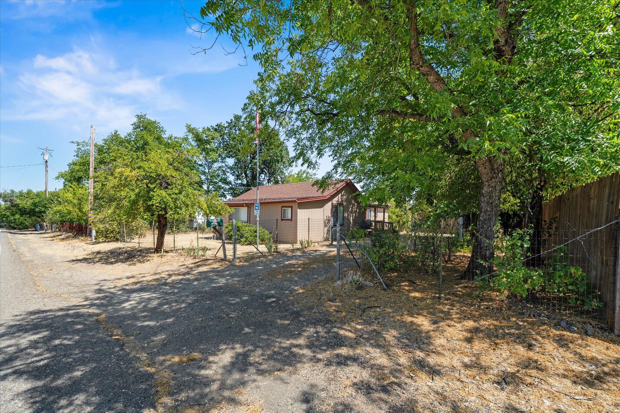 6535 Placer Road Igo, CA 96047 - Photo 31 of 39 a backyard of a house with lots of green space