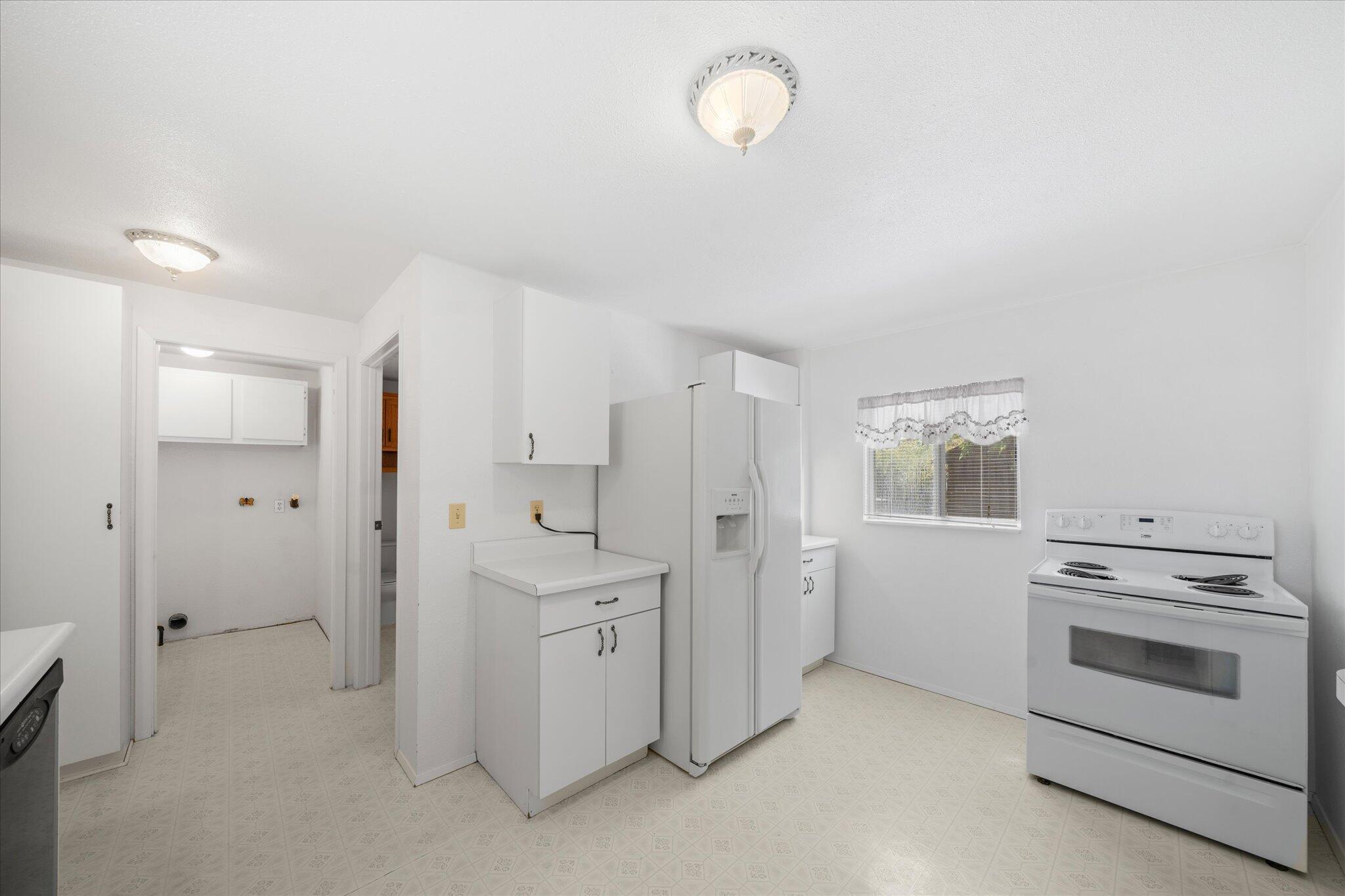 6535 Placer Road Igo, CA 96047 - Photo 8 of 39 a view of a kitchen with white cabinets
