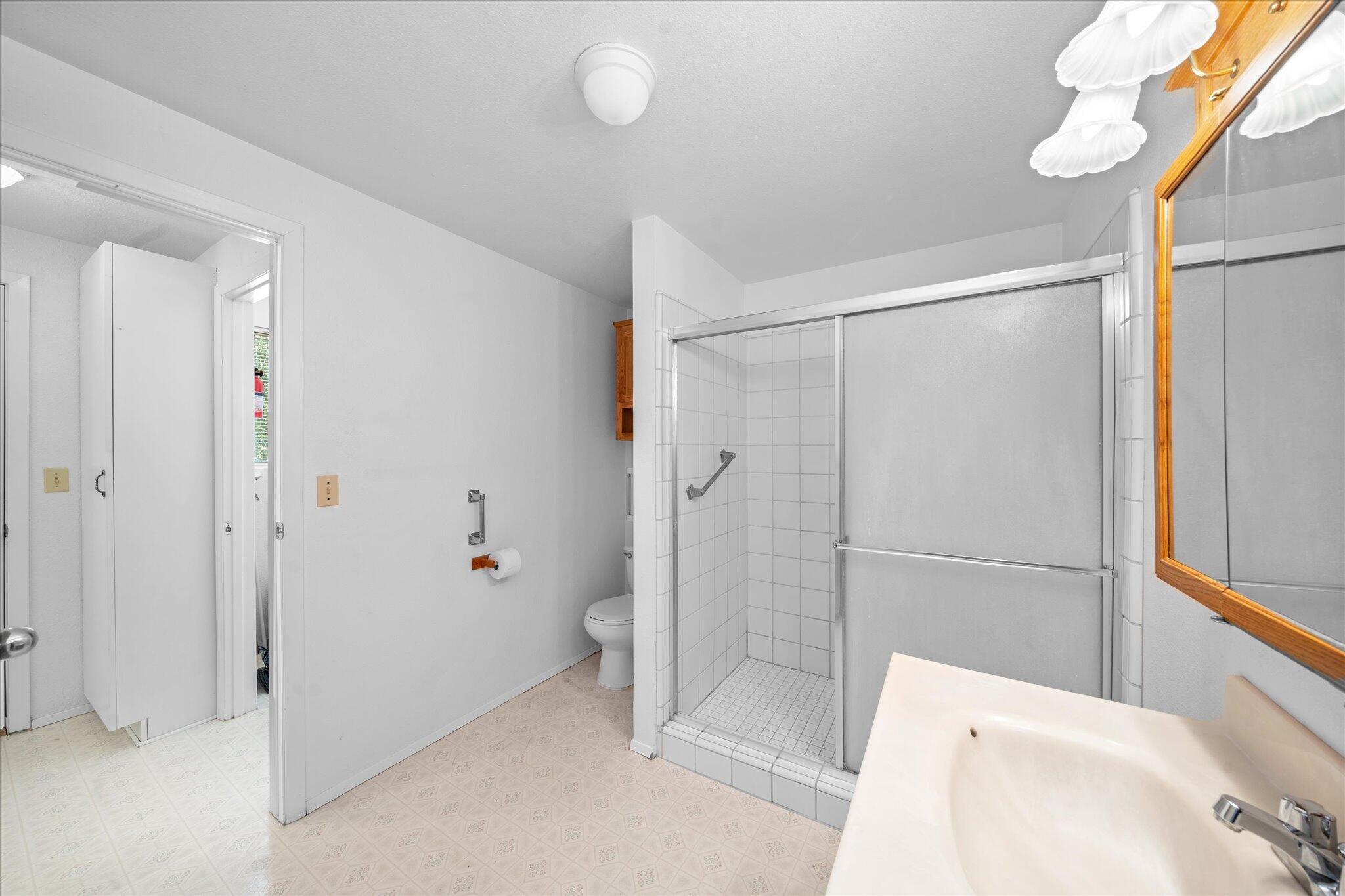 6535 Placer Road Igo, CA 96047 - Photo 10 of 39 a bathroom with a bathtub and a shower