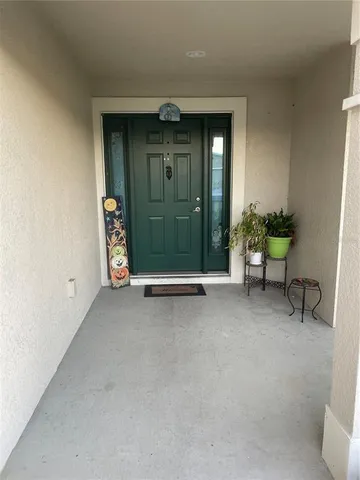a kitchen with granite countertop a stove a sink and a microwave