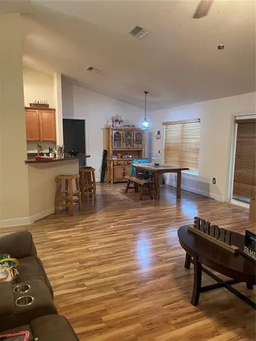 a bedroom with a bed and a mirror