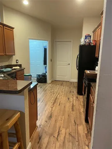 a kitchen with a refrigerator stove and microwave