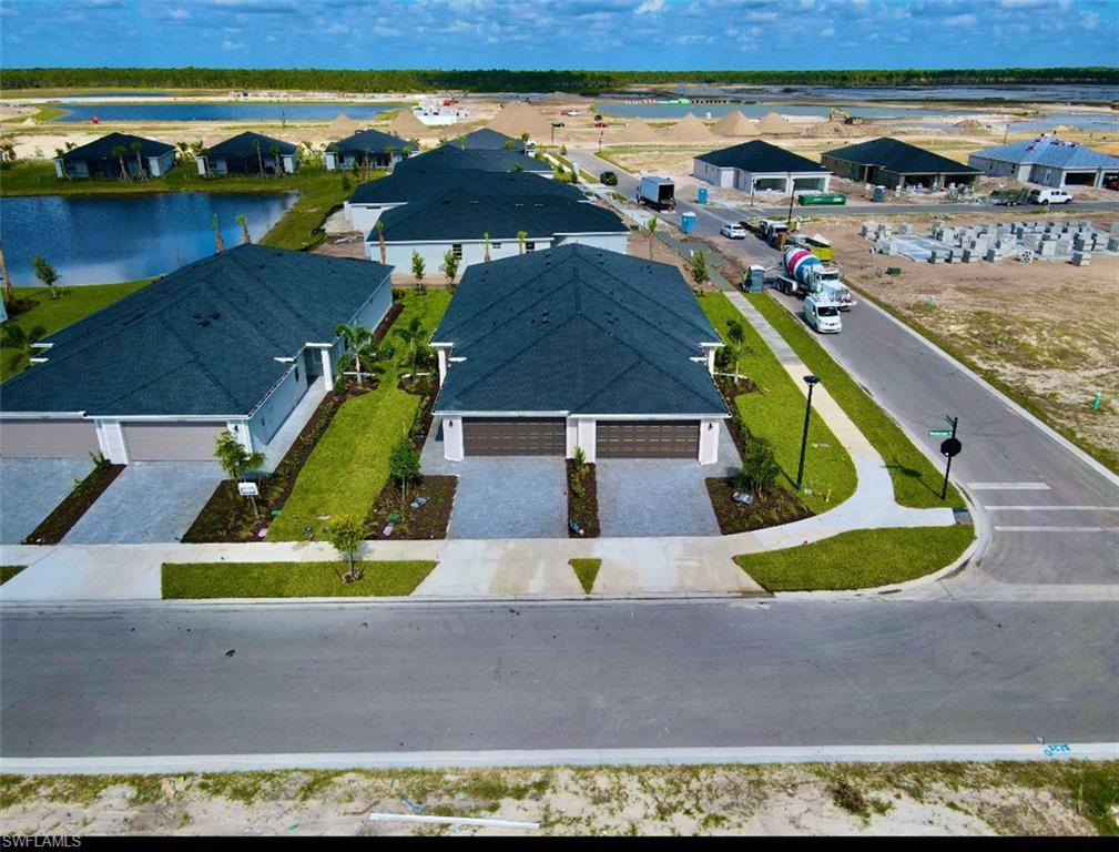 an aerial view of a house with a yard basket ball court and outdoor seating