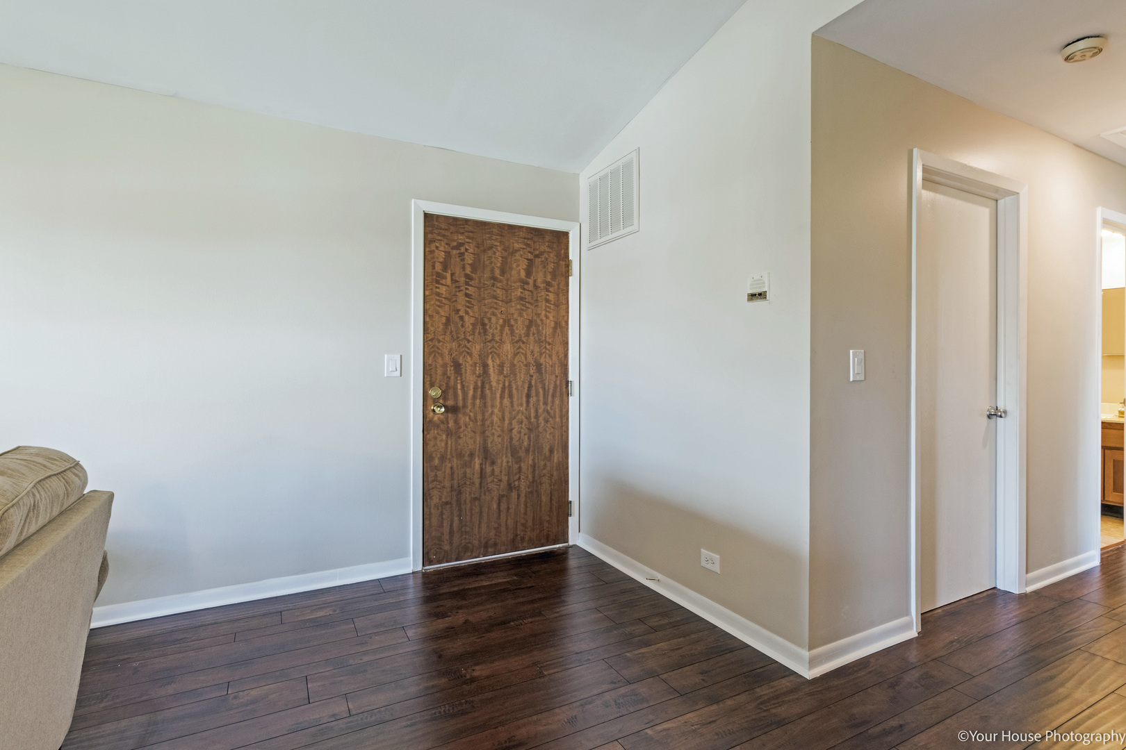 150 West Golf Road, Unit B Libertyville, IL 60048 - Photo 3 of 19 a view of an empty room with wooden floor and closet