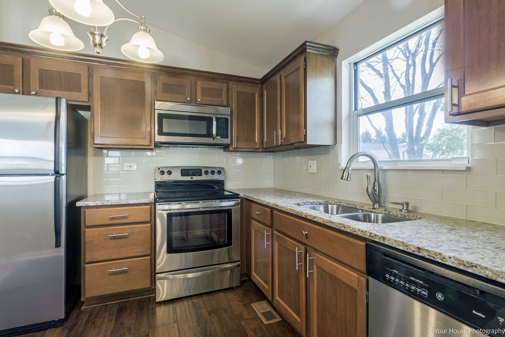 150 West Golf Road, Unit B Libertyville, IL 60048 - Photo 8 of 19 a kitchen with a stove microwave and a sink