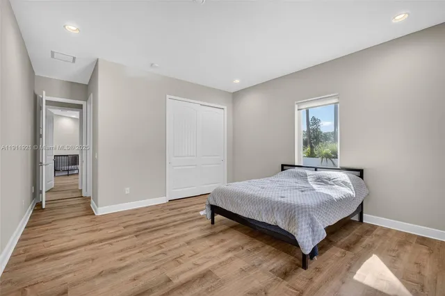 a view of a house with garden and trees