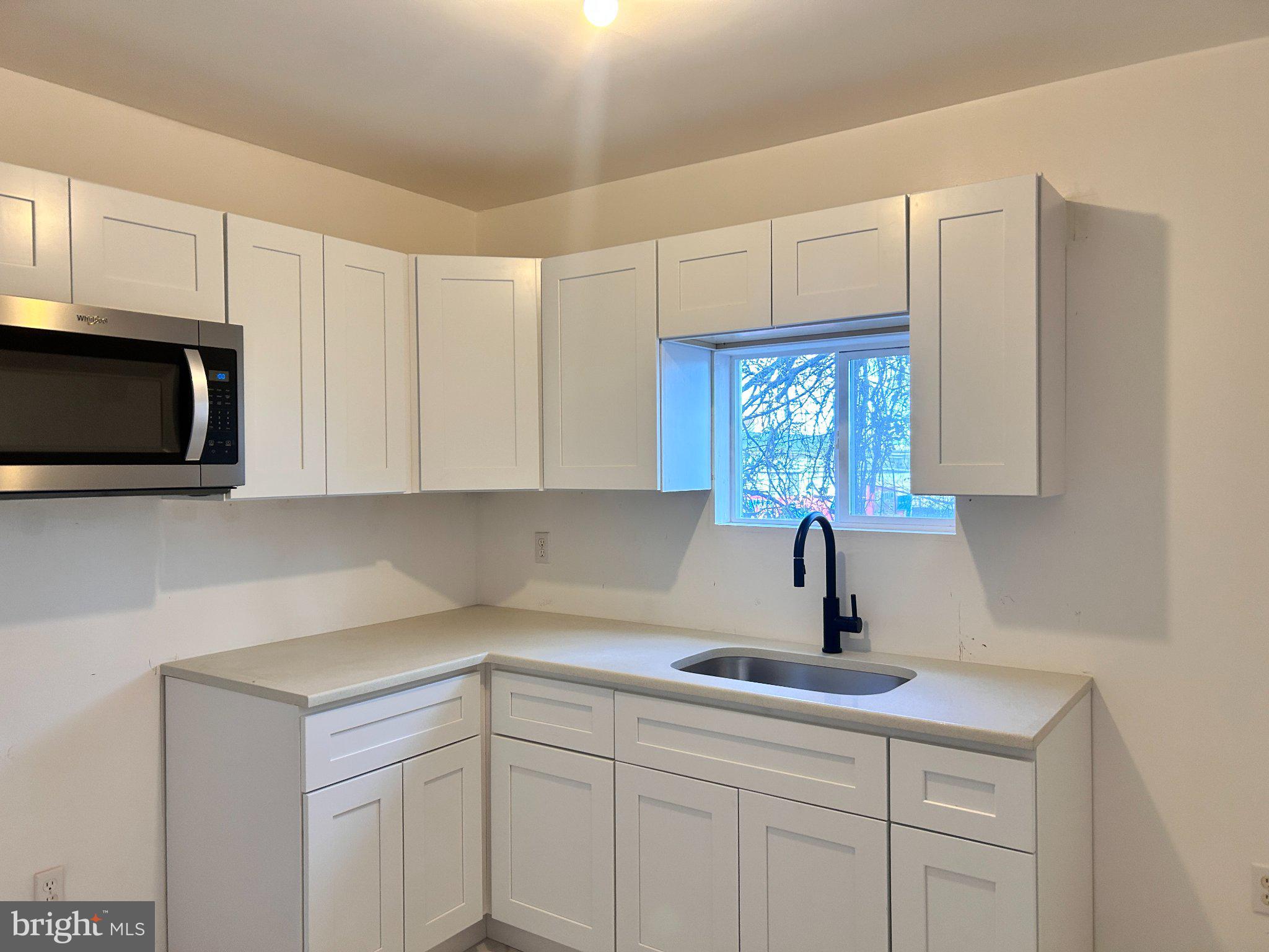 2019 Buckius Street Philadelphia, PA 19124 - Photo 1 of 9 Modern kitchen with sleek cabinetry.