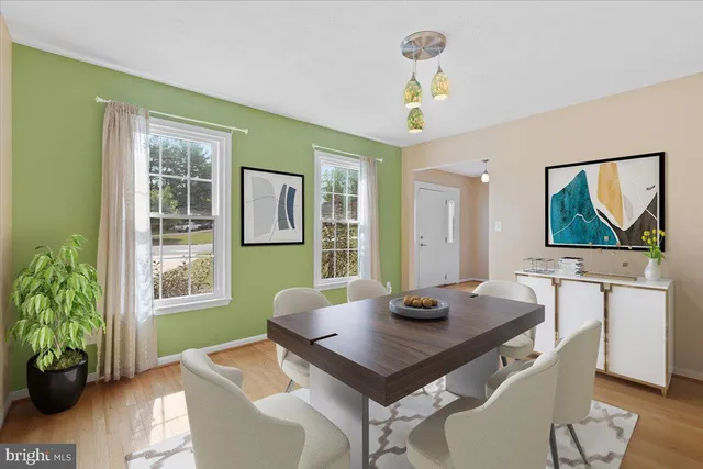 a kitchen with stainless steel appliances granite countertop a sink and a refrigerator