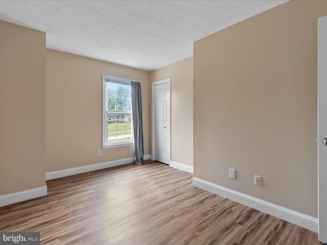 an empty room with white walls