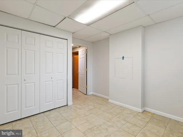 a view of an house with backyard space and balcony