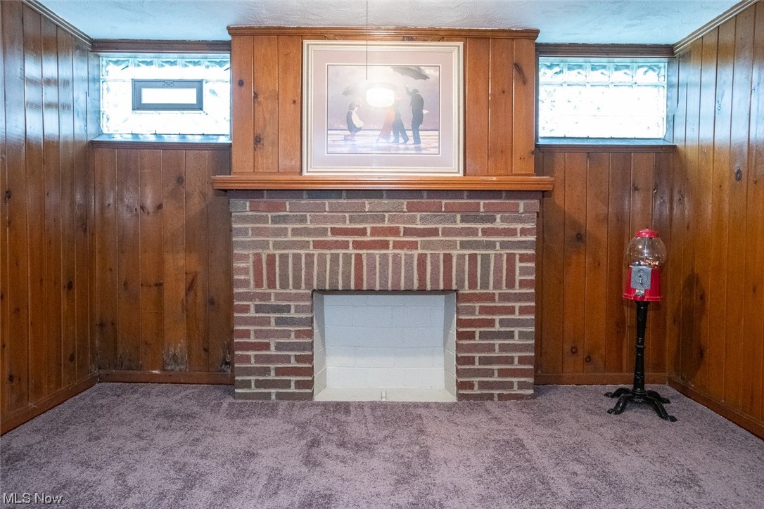 15716 Munn Road Cleveland, OH 44111 - Photo 20 of 24 w/decorative fireplace, ornamental molding, newer carpet, glass block windows
