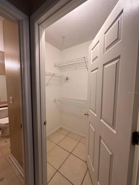 4364 South Kirkman Road, Unit 313 Orlando, FL 32811 - Photo 19 of 27 a bathroom with a shower